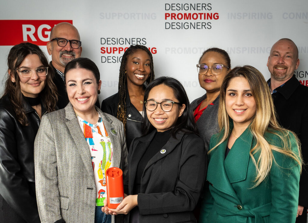 Team Fusion, our clients from Strides and our illustration partner, Jaida posing as a group with our branding award.